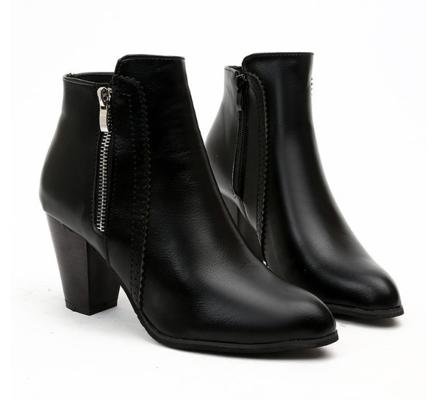 Black leather ankle boots with zipper on a white background